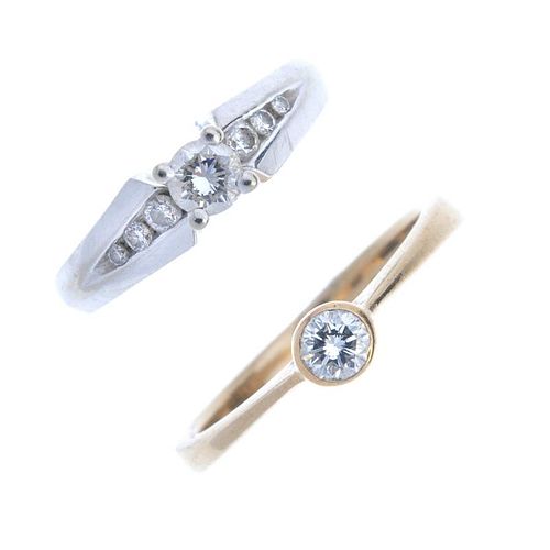 Two diamond single-stone rings. To include a 9ct gold brilliant-cut diamond ring with tapered band,