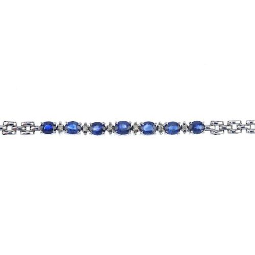 A sapphire and diamond bracelet. Designed as a series of oval-shape sapphires, with brilliant-cut di