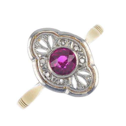A mid 20th century gold and platinum synthetic ruby and diamond dress ring. The circular-shape synth