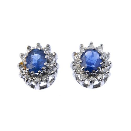 A pair of 18ct gold sapphire and diamond cluster ear studs and a diamond pendant. The ear studs each