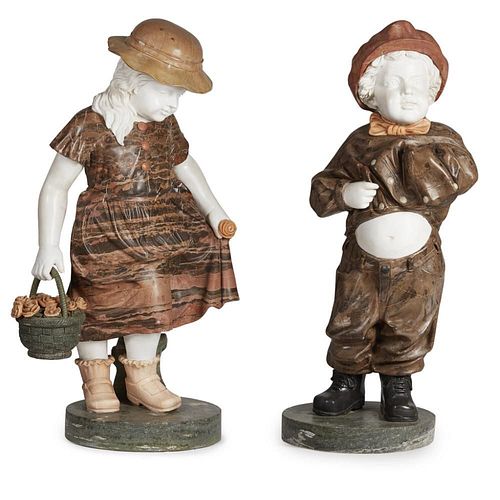 A PAIR OF ROUGE AND WHITE MARBLE STATUES Children in