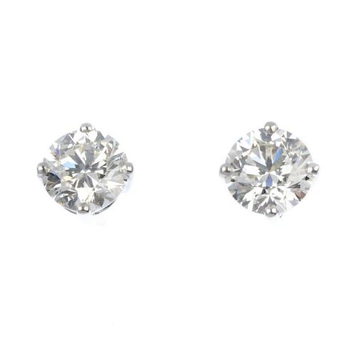 A pair of brilliant-cut diamond ear studs, weighing 2.24cts and 2.07cts. Accompanied by report numbe