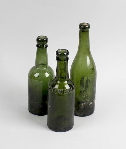 Two boxes containing a large collection of assorted glass bottles To include green glass beer and ut