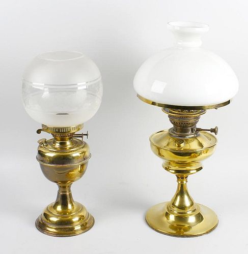 Two converted brass lamps. Each with glass shade, largest 21.5 (54.5 cm) high. (Requires re-wiring).