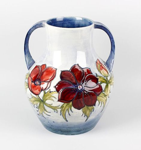 A large Moorcroft 'Anemone' pattern two-handled vase. Of bulbous form with tube-lined decoration on