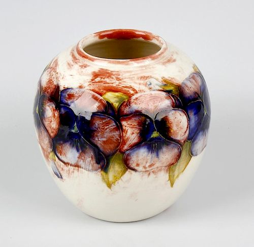 An unusual Walter Moorcroft 'Pansy' pattern vase Circa 1950, of ovoid form, with tube-lined decorati