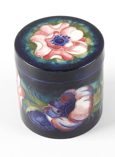 A Moorcroft pottery Anemone pattern jar and cover Of cylindrical form, the flat circular cover and t