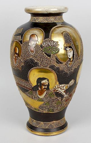 A Japanese Satsuma vase. Taisho period c. 1930, of baluster form with tube-lined decoration of deiti