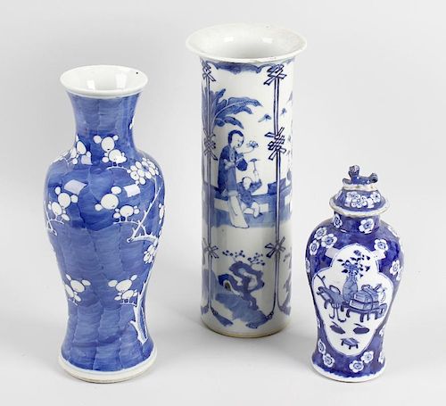 Three Chinese blue and white vases. Comprising one example of baluster form decorated with cherry bl