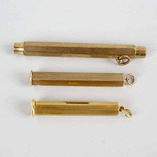 An 18ct gold cigar piercer, the hexagonal outer case enclosing cylindrical piercer and the whole wit