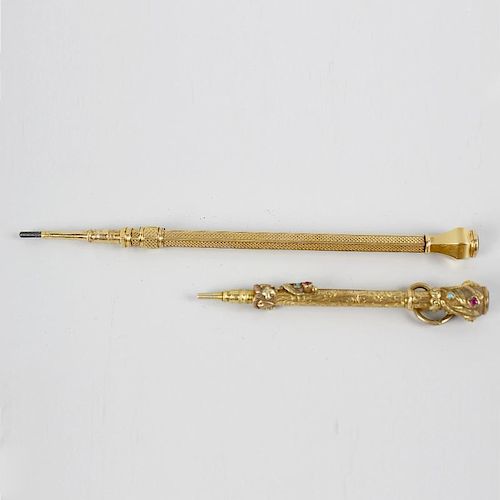 Two yellow metal and gem set Sampson Mordan & Co. retractable pencils. The first having foliate engr