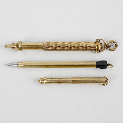 Three yellow metal retractable pencils. Comprising two Sampson Mordan & Co. examples, the larger hav
