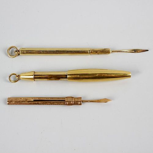 An 18ct gold retractable pencil of plain ovoid form, plus a toothpick within plain cylindrical outer