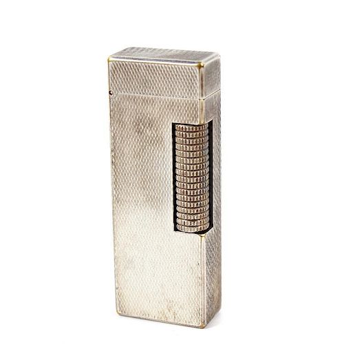 A Dunhill rollagas lighter, the rectangular shaped body with engine turned decoration, impressed Dun