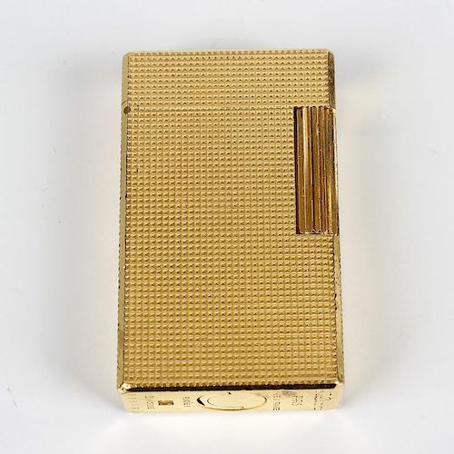 A Dupont gold-plated cigarette lighter. 558CFJ, of textured rectangular form, 2.25, (5.5cm) high. <b