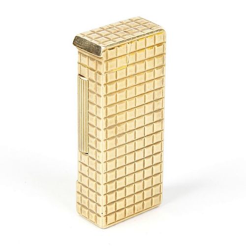 A Dunhill 9ct gold lighter. Of rectangular form having chequered texture to the whole, hallmarked Al