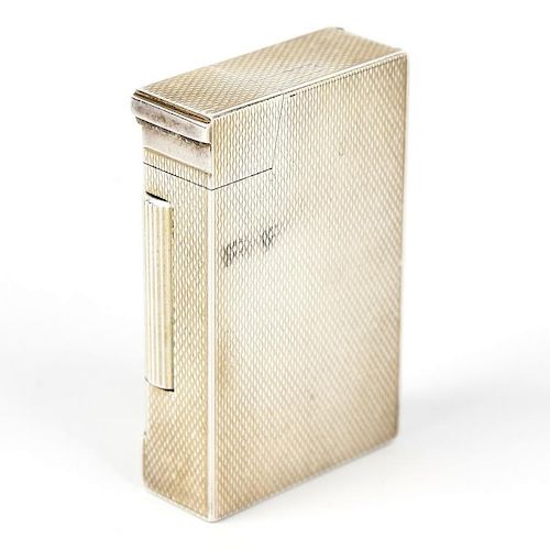 A silver lighter. Or rectangular form having textured surface to the whole, hallmarked Bach & Cooper