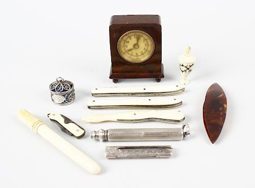 A selection of items, to include an unusual early 20th century tape measure with brown Bakelite case