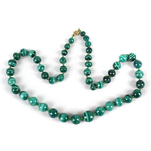 A malachite bead necklace. Formed of 47 graduated spherical beads, 24.5, (62cm) long. <br><br>VGC