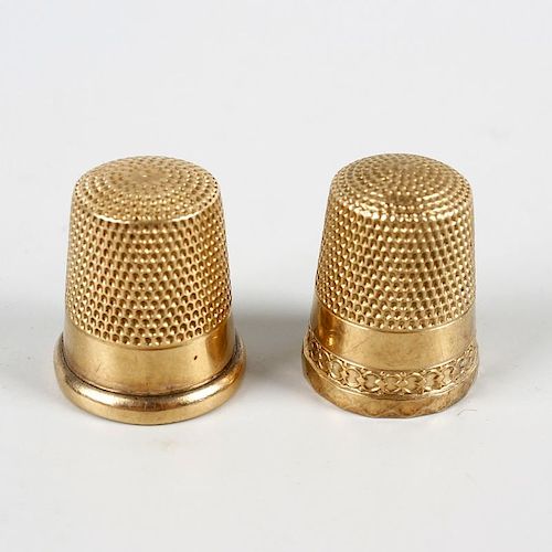 Two 10K yellow metal thimbles. One initialed CMS and numbered 9, the other initialed MG, both intern