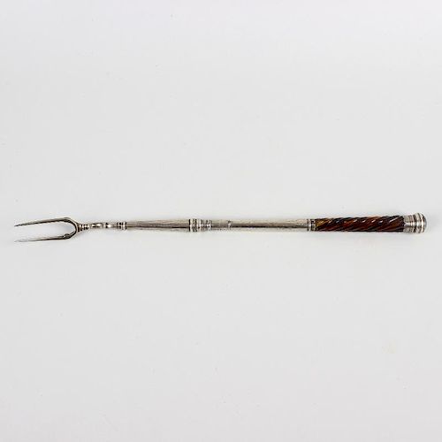 An unusual tortoiseshell-handled white metal toasting fork. Believed 18th century, the two-prong hea