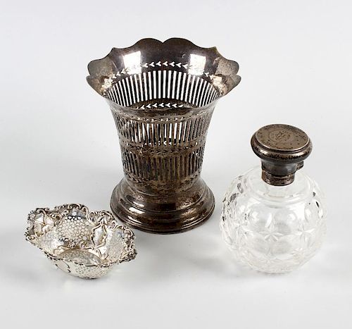 A small group of silver items. Comprising a pair of silver lidded toiletry jars with initialled hing