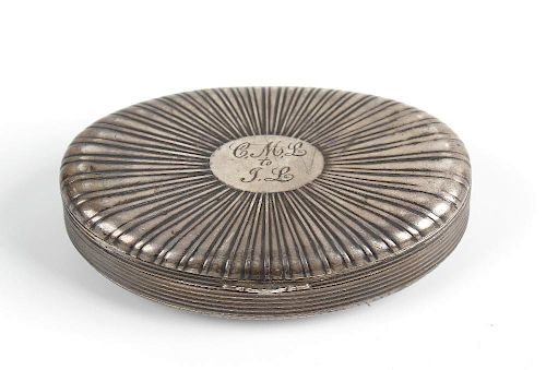 A Continental white metal oval snuff box Circa 1800, the fan-reeded hinged cover with oval cartouche