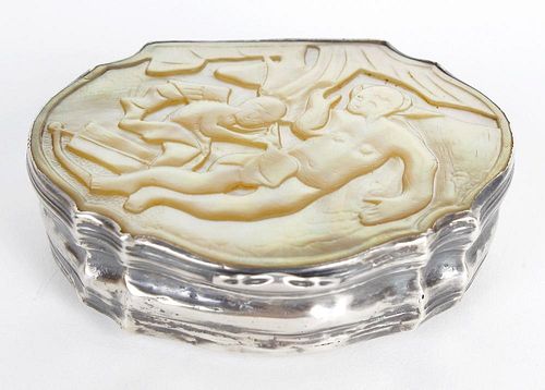 A mother-of-pearl mounted snuff box. Of organic form having low relief carved scene to the hinged co