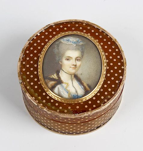 A 19th century French inlaid horn patch box The circular push-on cover centred by an oval portrait o