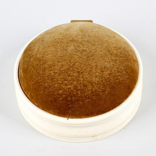 A 19th/early 20th century ivory dressing table box, with domed hinged pin cushion cover, enclosing a