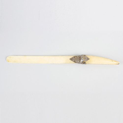 A mid-Victorian silver-mounted ivory paper knife or page-turner. The 11-inch blade with rounded tip