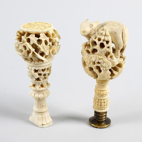 Two 19th century Chinese Canton carved ivory desk seals. Each of intricately pierced form, the first