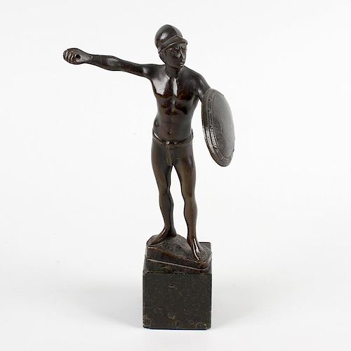 A 19th century Grand Tour souvenir bronze of a gladiator, modelled in a standing pose holding a shie