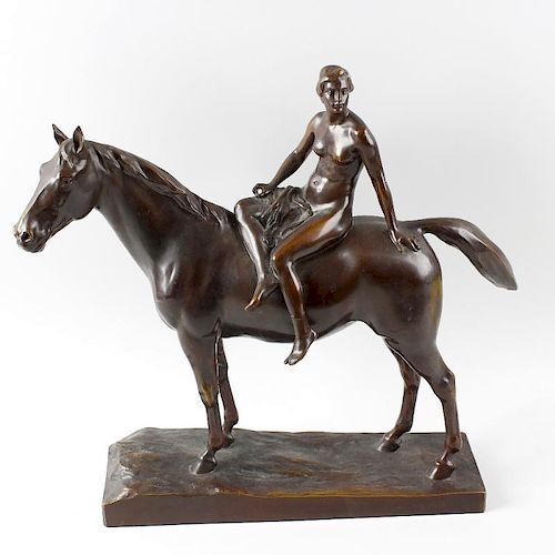 An Art Deco bronze figure group. Modelled as a female nude sat upon a horse, probably depicting Lady