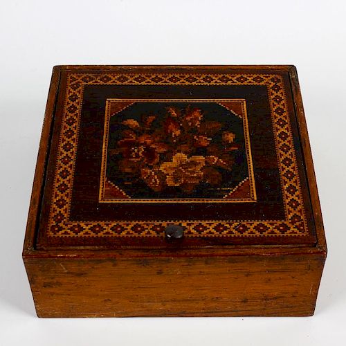 A Victorian Tunbridgeware table box. Of square form, the hinged cover inlaid with flowers, framed by