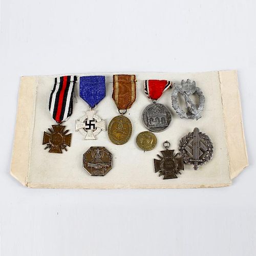 A group of assorted German badges and medals. To include World War I and Third Reich examples, (9).