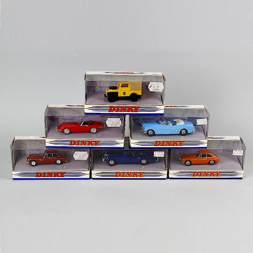 A box containing 51 Matchbox Dinky diecast model vehicles. To include sports cars and other vehicles