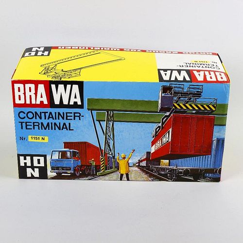 A box containing a mixed selection of Brawa, Pola and other H0/00 model railway plastic model buildi