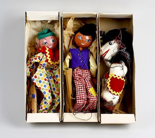 Three boxed Pelham puppets Comprising 'Katie Clown', 'Dutch Boy' and a horse, in printed yellow card