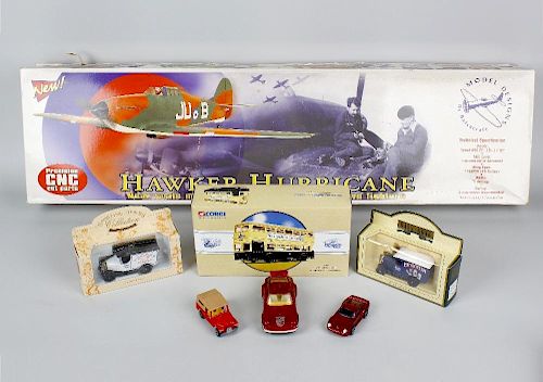 A box containing assorted toys and models. To include Balsacraft Hawker Hurricane, mechanical Hector