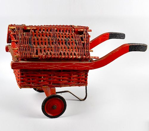 A 1930s GPO type toy cart. With red painted hinged cane and wicker roof, over conforming body and wo