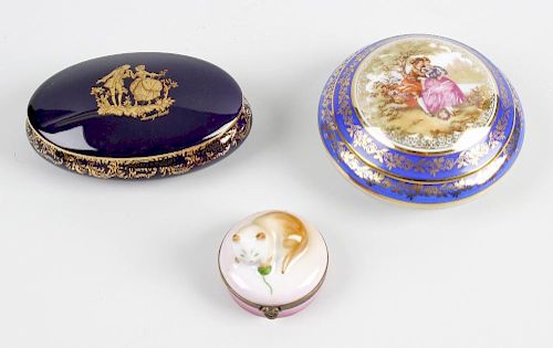 A box containing an assortment of modern porcelain and papier mache boxes. Together with a large qua