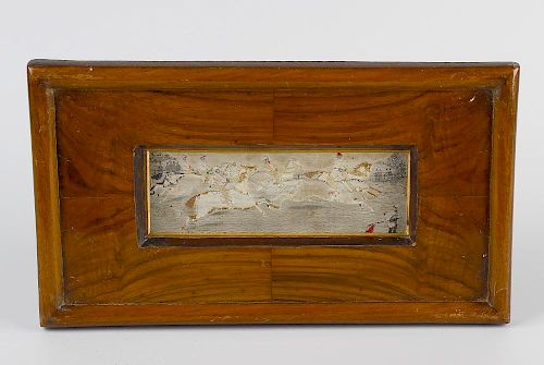 A framed silk work picture of Stevengraph type, depicting a steeplechase with six riders and horses,