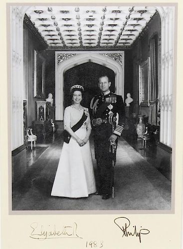 A black and white photographic print of Queen Elizabeth and Prince Phillip Ink signatures beneath an