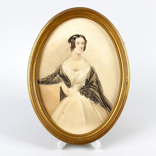 An early Victorian oval watercolour portrait of a lady.Depicted knee-length in three-quarter profile