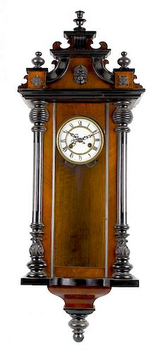 A walnut and ebonised spring-driven Vienna wall clock With white Roman dial and two-train movement w