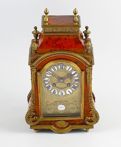 A good 19th century French red tortoiseshell mantel clock The break-arched brass dial with enamel ca