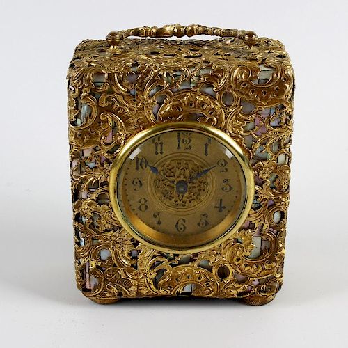An unusual late 19th century French mother of pearl and gilt metal travel clock. With 2.25-inch Arab