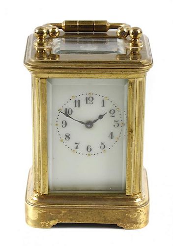 A miniature brass corniche case (mignonette) carriage clock, the cream enamelled Arabic dial with gi