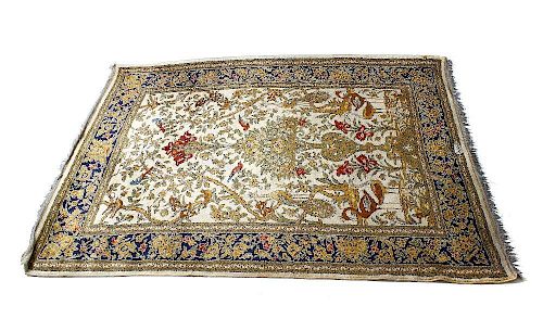 A Kirman-type 'Tree of Life' garden rug. The ivory filed decorated with birds flanking a tree, withi